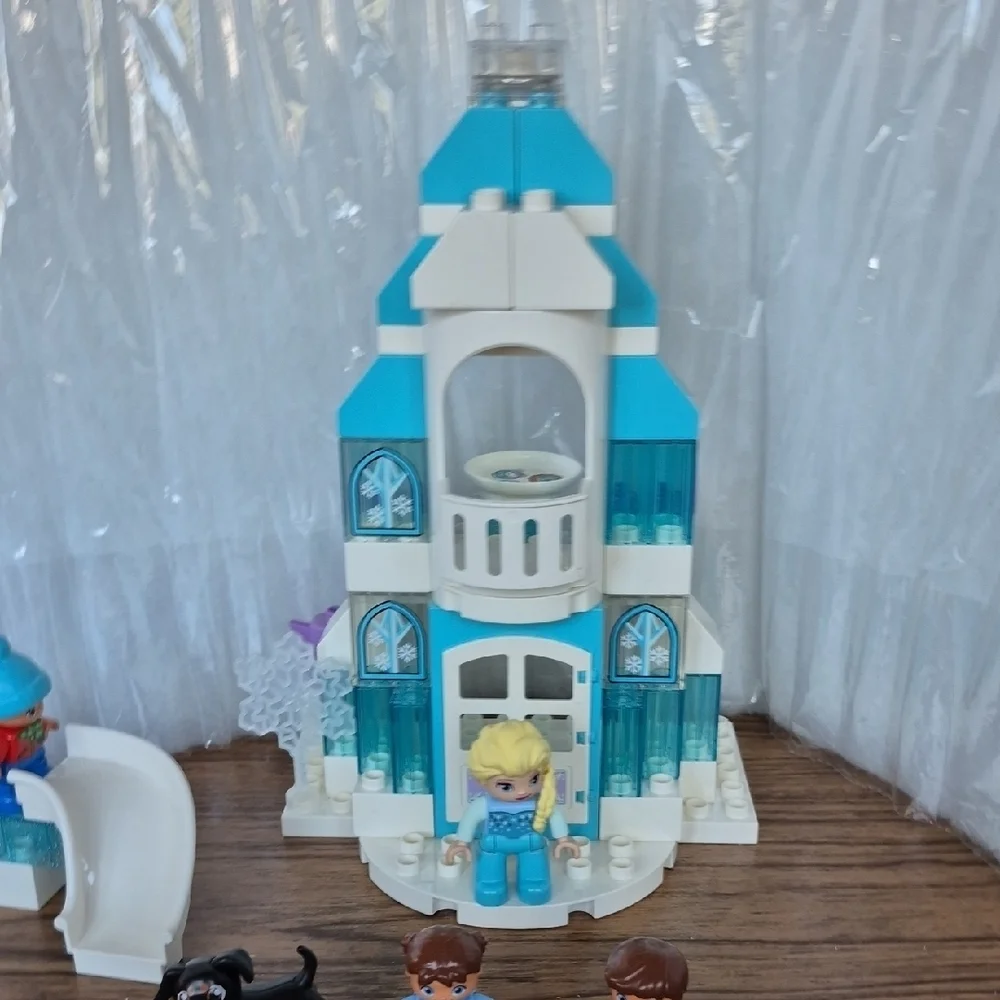 Dusney Frozen Castle Building Set with Light Brick Plus Doggie And Kids Playing.